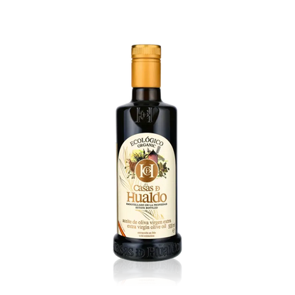 Casas de Hualdo Bio Olivenölflasche auf schwarzem Hintergrund.