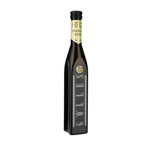 Gölles Spargelessig Flasche vor schwarzem Hintergrund.